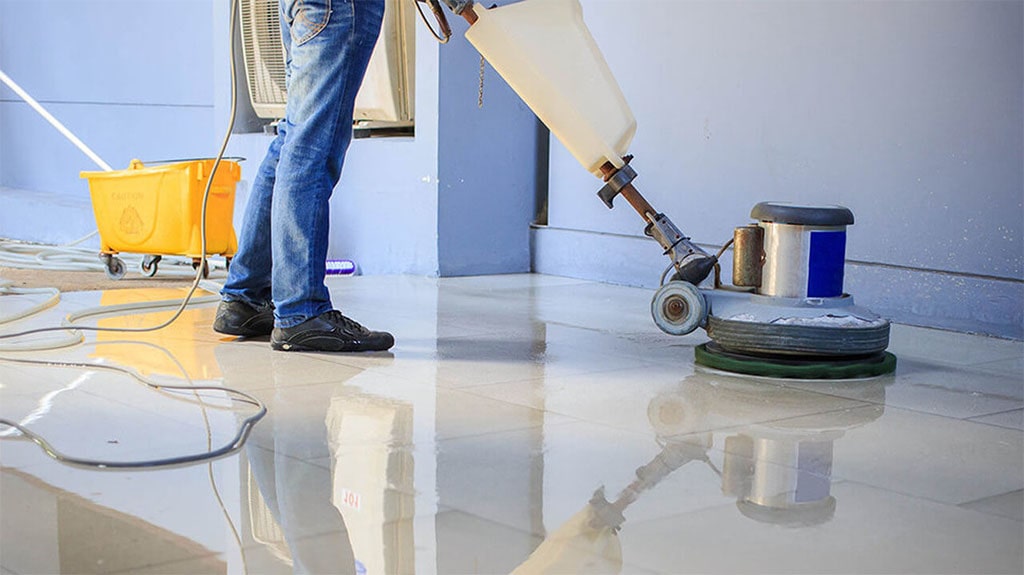 technician polishing granite floor